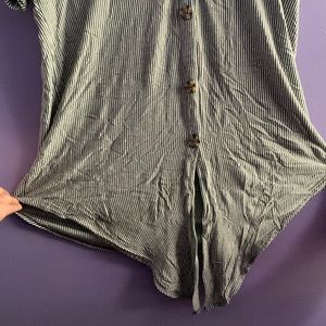 Casual/ Business Casual button up shirt with tie at the  bottom.